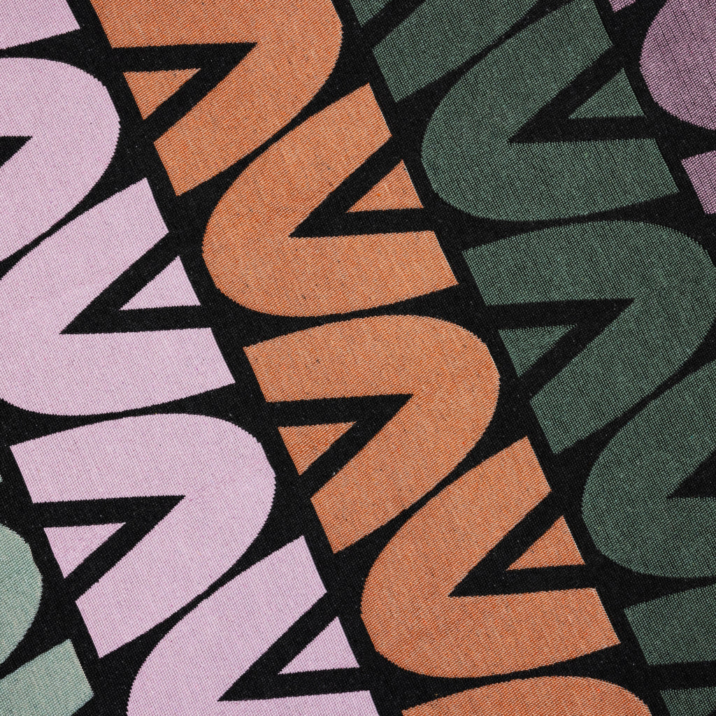 Patterned studio potato rug with multicolor geometric design